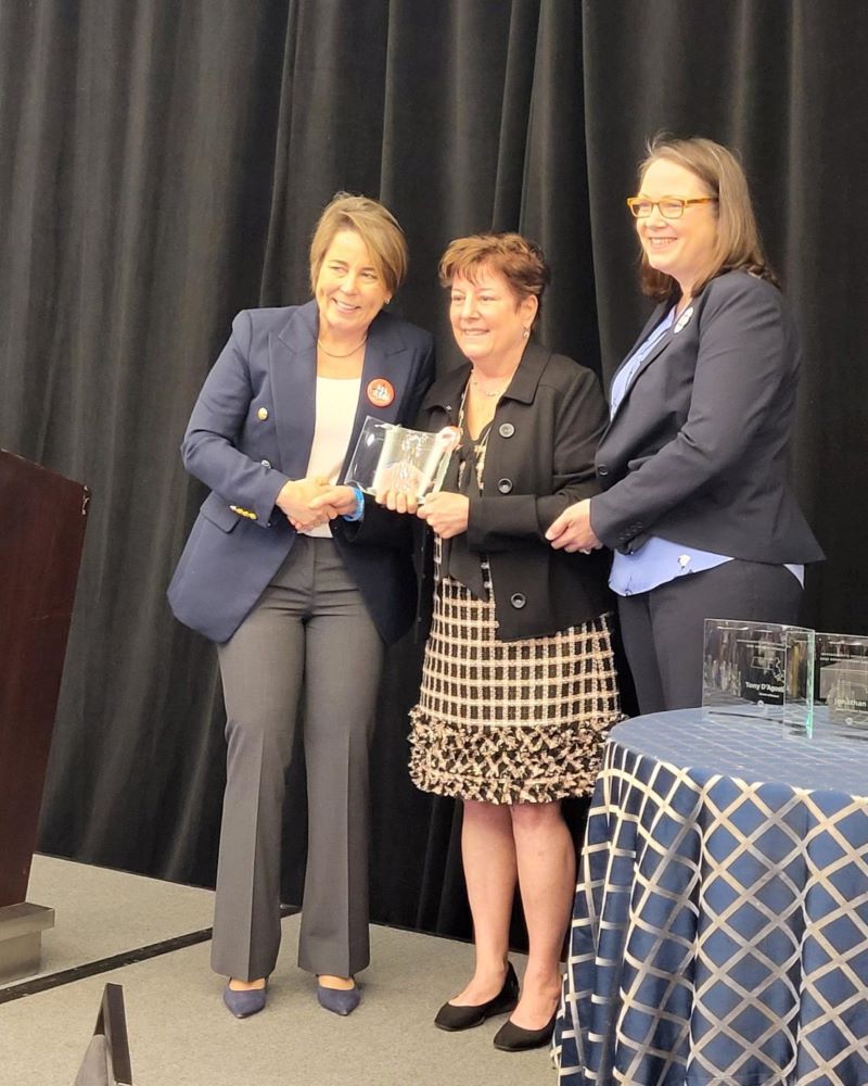 Gov. Maura Healey presents Patti Lloyd with the Larry D. Meehan Lifetime Achievement award at the Governor's Conference on Travel and Tourism on April 2.