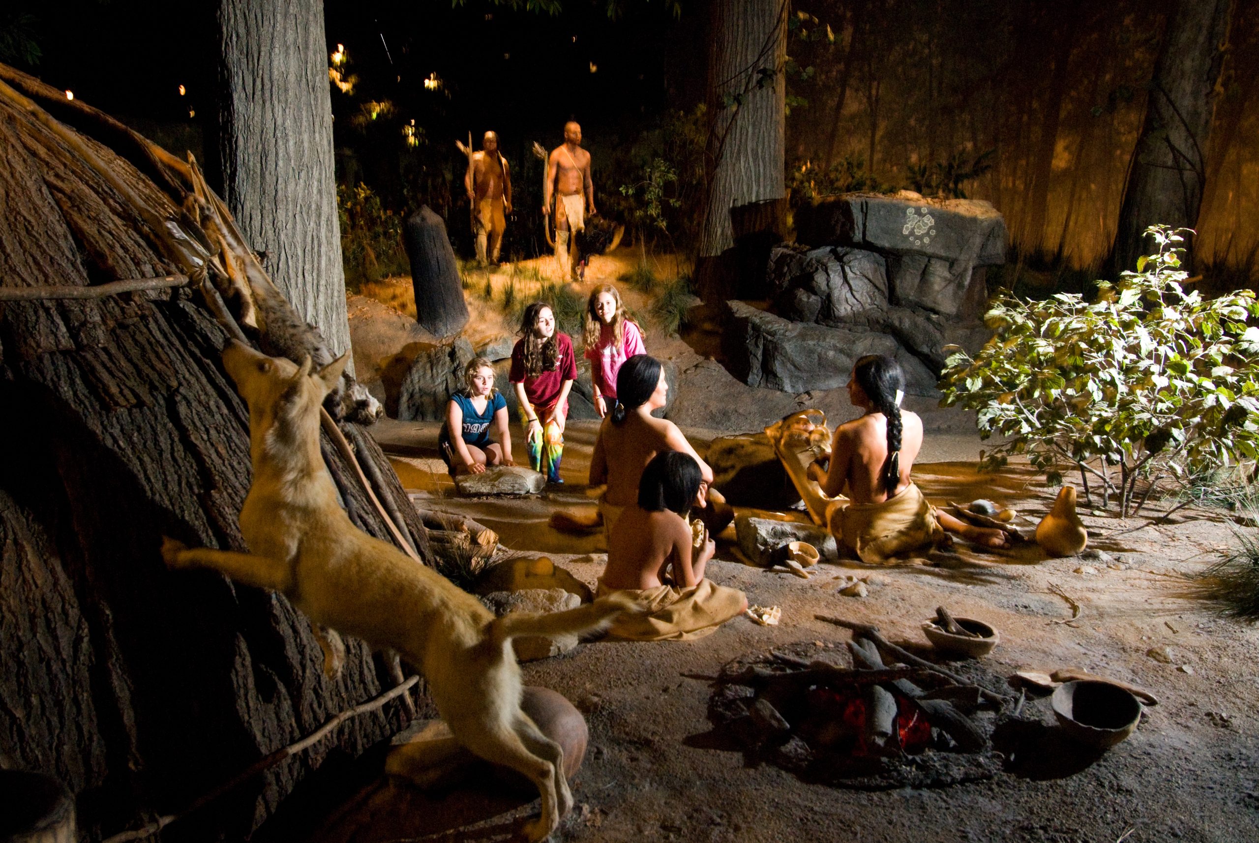 three kids at an exhibit at the Mashantucket Pequot museum in Connecticut