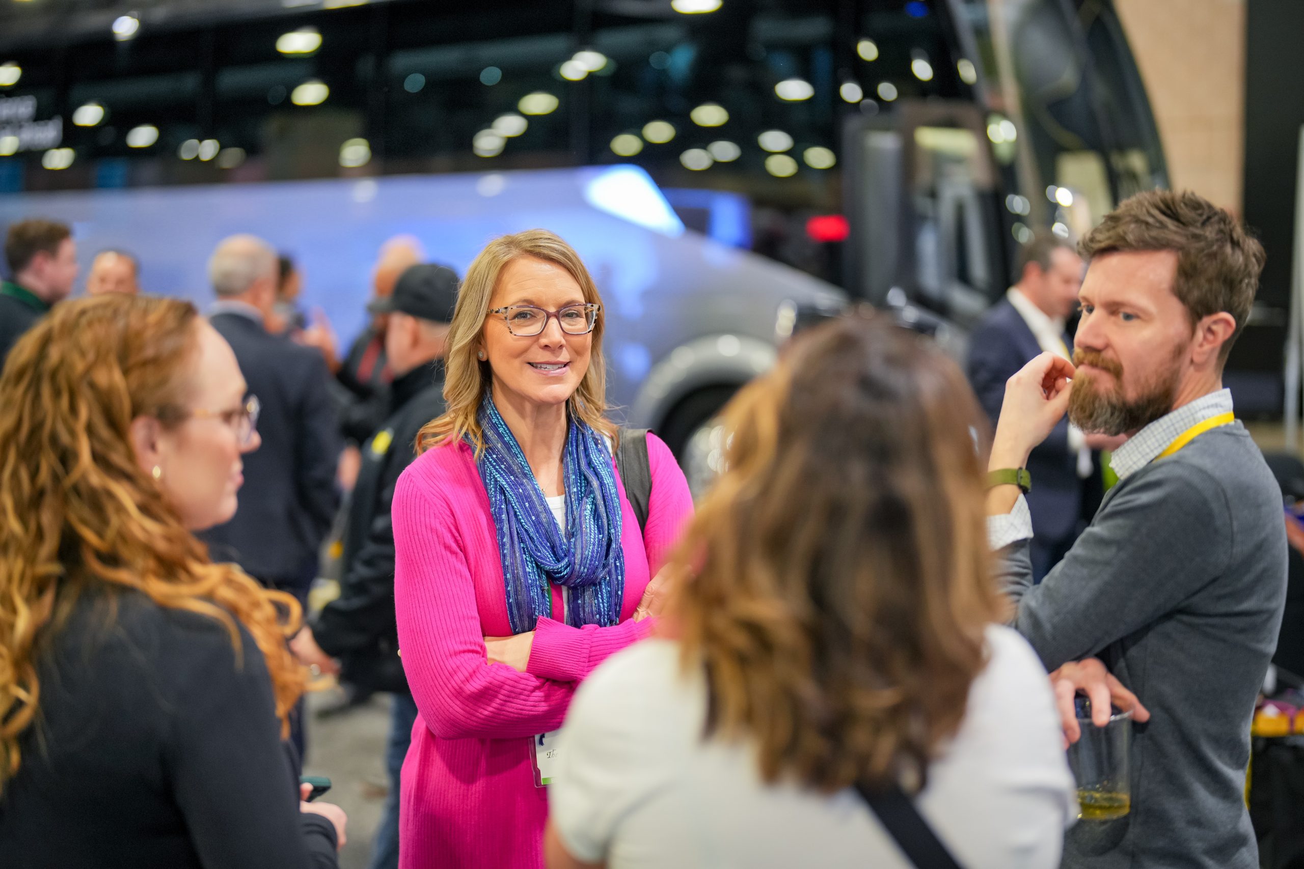 An image showing a group of people standing in a circle at an ABA event. They are happily engaged in conversation.