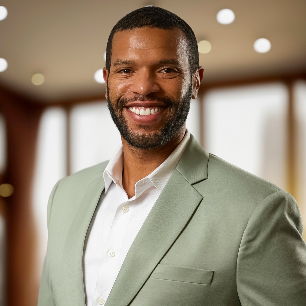 A headshot of Lewis "Lew" Myers III.